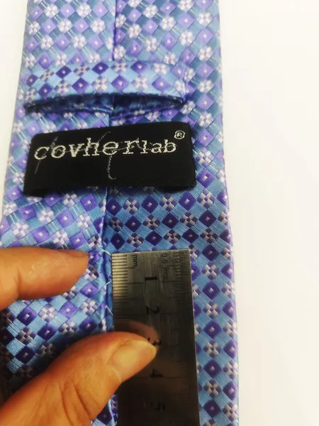 A close - up of the stitches on a tie, highlighting uniform width and neatness
